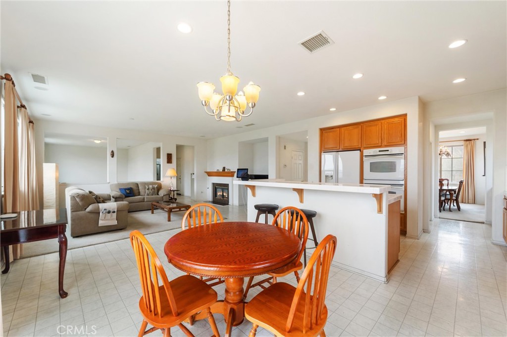 17191 Greentree Drive Riverside, CA 92503 - Photo 10 of 53 a view of a dining room with furniture