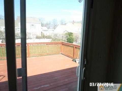 554 New Dover Road Colonia, NJ 07067 - Photo 5 of 13 a view of an empty room and wooden floor