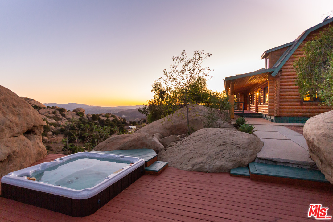 7429 Studio Road West Hills, CA 91304 - Photo 36 of 44 a view of roof deck with mountain view and wooden floor