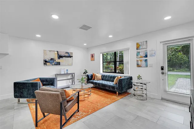 a living room with furniture and a window
