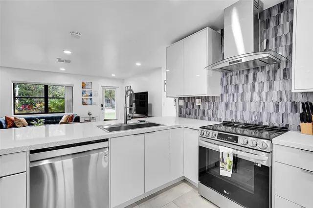 a kitchen with a stove and a refrigerator
