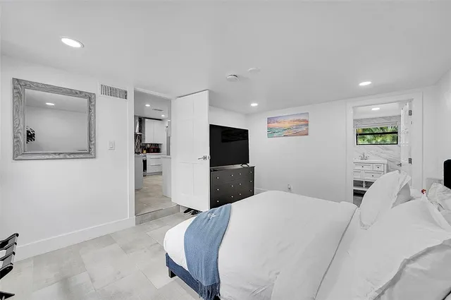 a bedroom with a bed and a furniture