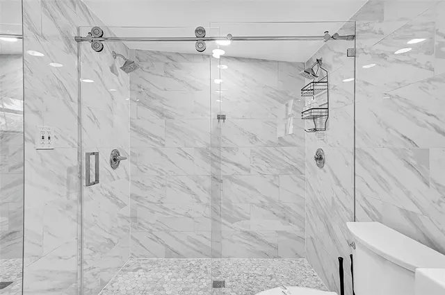 a view of a chair and table in the patio next to a yard