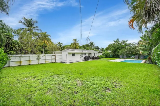 a park with a bench and trees