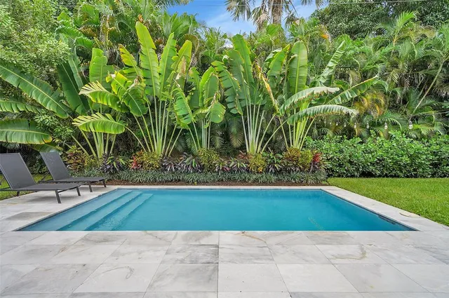 a view of a swimming pool with an outdoor space