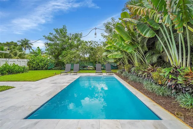 a view of a yard with a bench