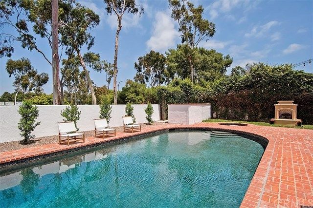 a view of a swimming pool with a yard