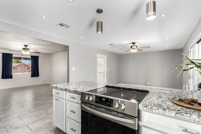 a kitchen with a stove and cabinets