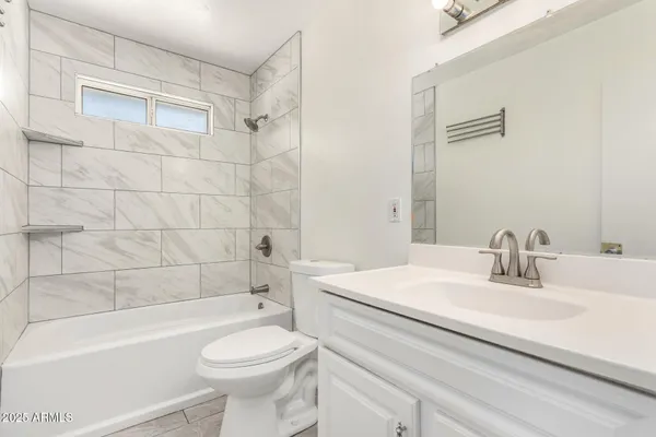 a bathroom with a sink a toilet and a bathtub