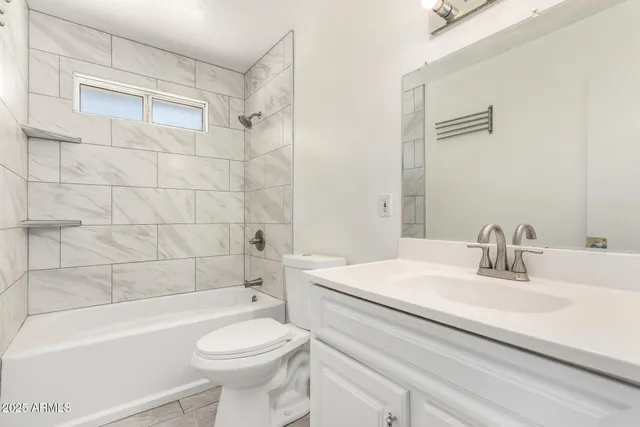 a bathroom with a sink a toilet and a bathtub