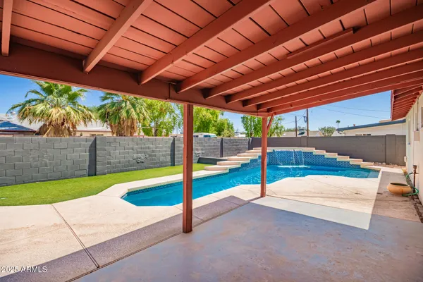 a view of yard with patio
