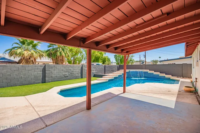a view of yard with patio