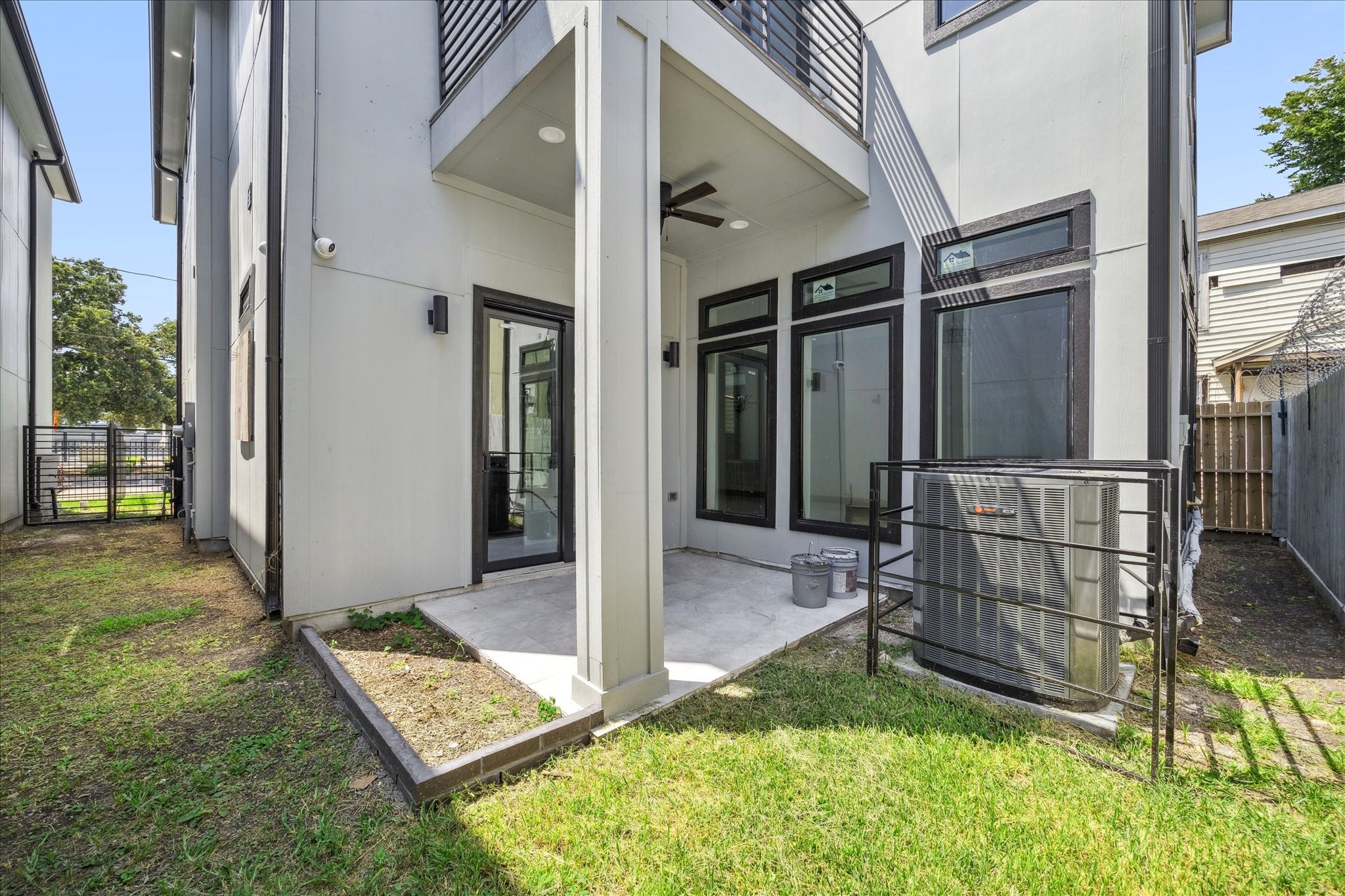2319 Tuam Street Houston, TX 77004 - Photo 28 of 28 Enjoy a covered patio just off the main living area, complete with a ceiling fan for comfort in warmer months. The adjoining yard adds flexibility for gardening, pets, or simple outdoor relaxation.