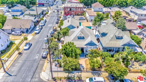 an aerial view of residential houses with outdoor space