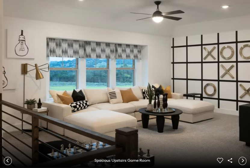 6408 Cypress Ranch Boulevard Spicewood, TX 78669 - Photo 12 of 13 a bedroom with furniture and a large window