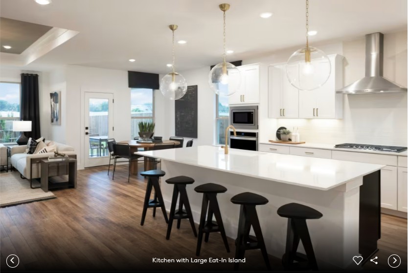 6408 Cypress Ranch Boulevard Spicewood, TX 78669 - Photo 7 of 13 a large kitchen with a table and chairs