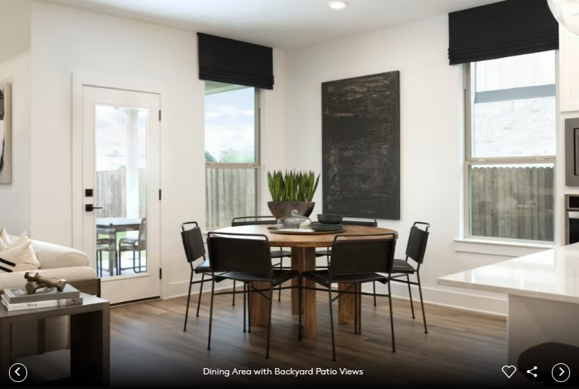 6408 Cypress Ranch Boulevard Spicewood, TX 78669 - Photo 8 of 13 a view of a dining room with furniture and wooden floor