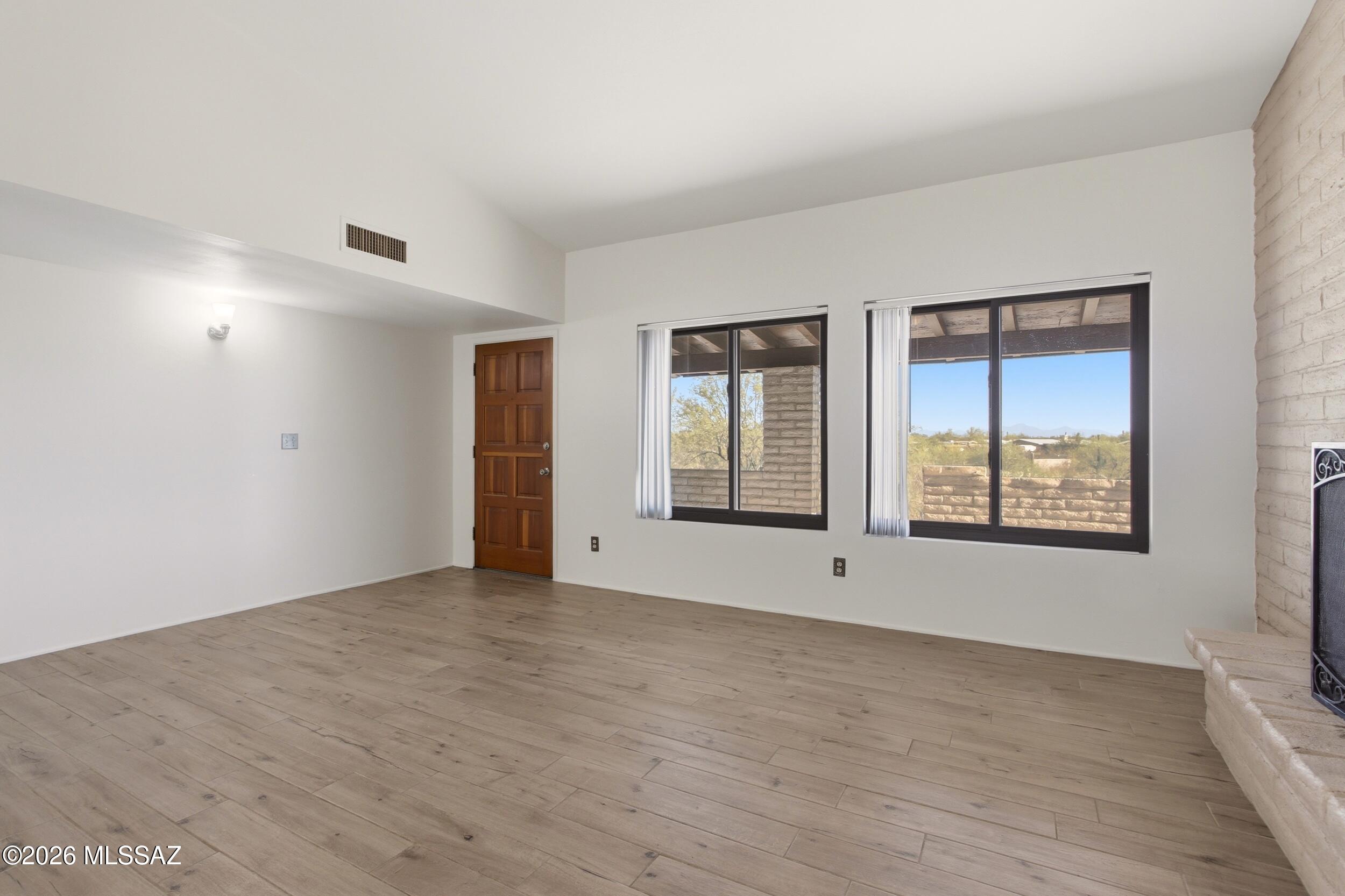9141 East Indian Canyon Road Tucson, AZ 85749 - Photo 6 of 33 a view of an empty room with window