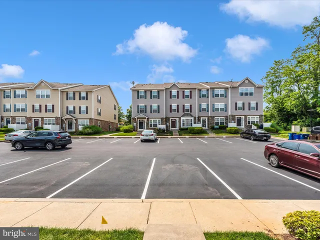 a city street lined with buildings and cars