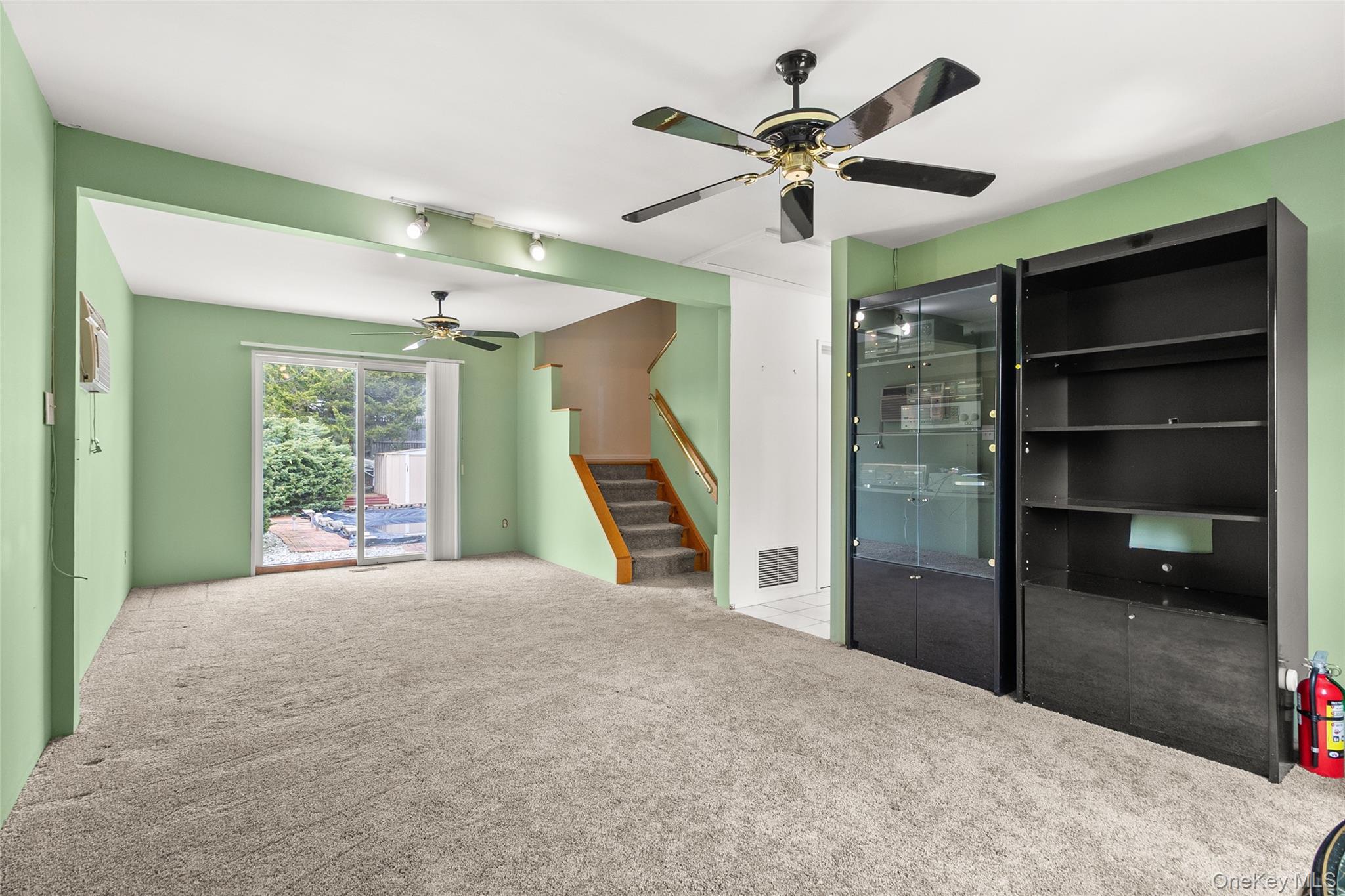 69 Amsterdam Road Smithtown, NY 11787 - Photo 11 of 22 Bonus Room with Sliders to the Back Yard