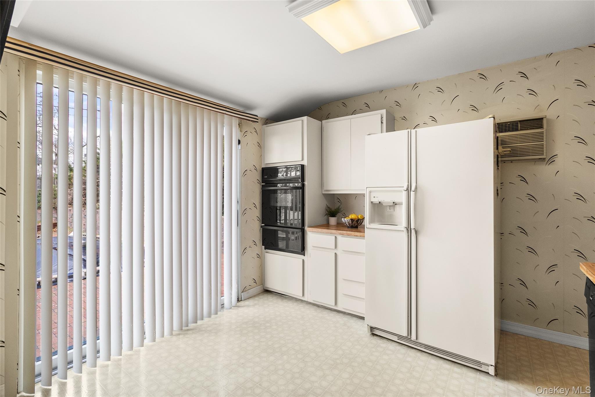 69 Amsterdam Road Smithtown, NY 11787 - Photo 9 of 22 Kitchen with Sliders to the Back Yard