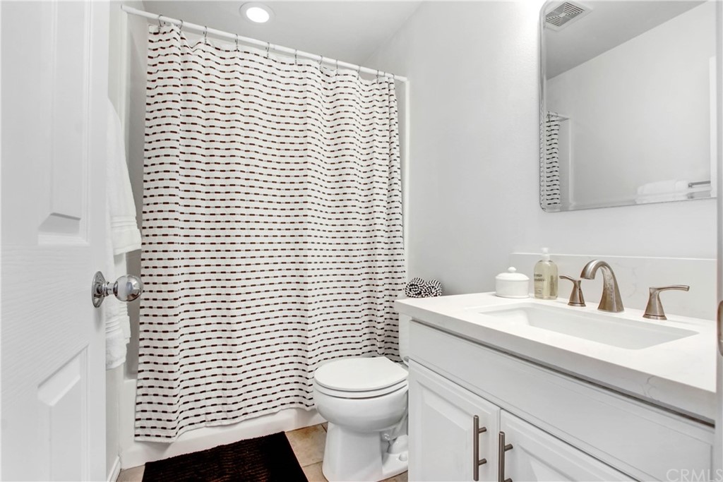 54 Clouds View Irvine, CA 92603 - Photo 24 of 39 a bathroom with a sink a toilet and mirror