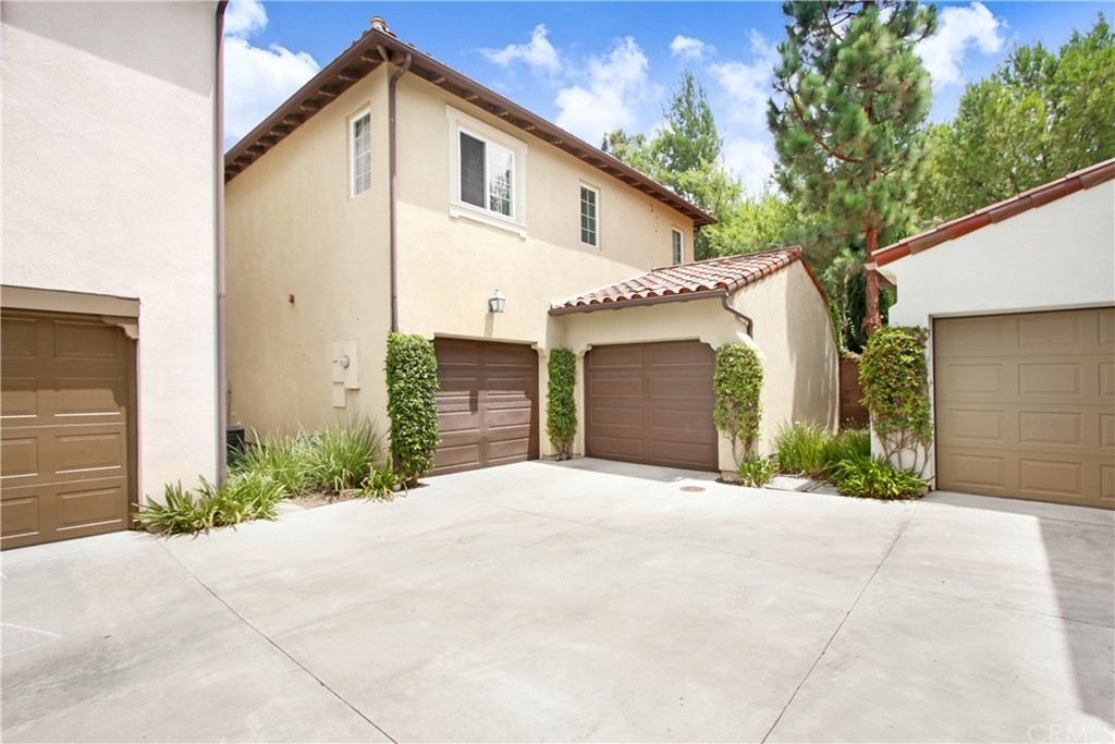 54 Clouds View Irvine, CA 92603 - Photo 25 of 39 a front view of a house with a yard and garage