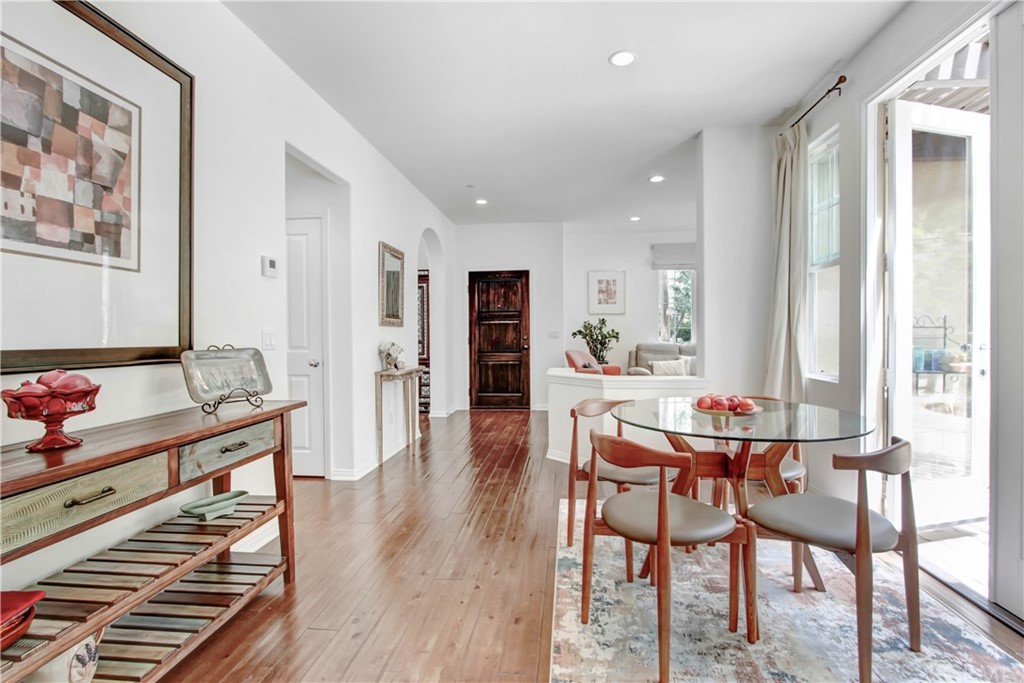 54 Clouds View Irvine, CA 92603 - Photo 10 of 39 a view of a dining room with furniture window and wooden floor