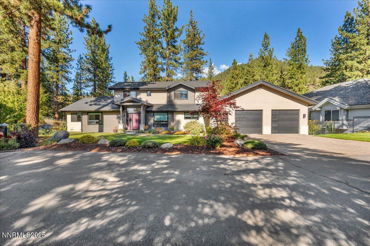 1262 Hidden Woods Drive Zephyr Cove, NV 89448 - Photo 1 of 81 a front view of a house with a garden