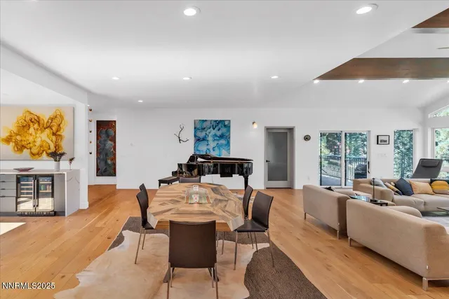 a large kitchen with a table and chairs in it