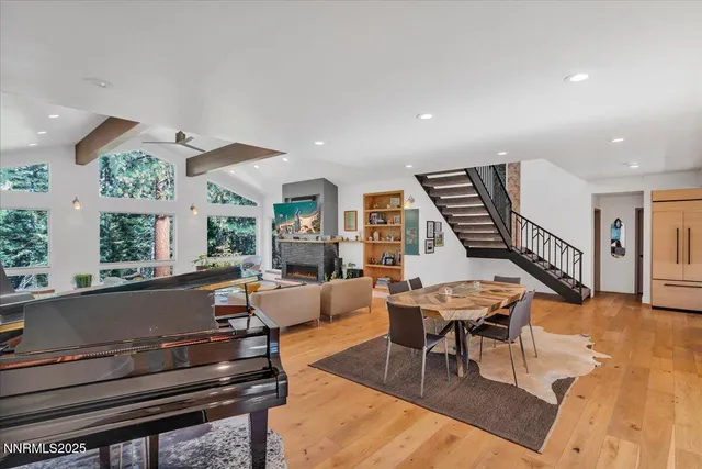 a large kitchen with a table and chairs in it