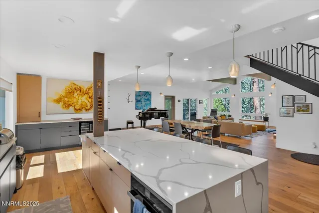 a kitchen with a stove and white cabinets