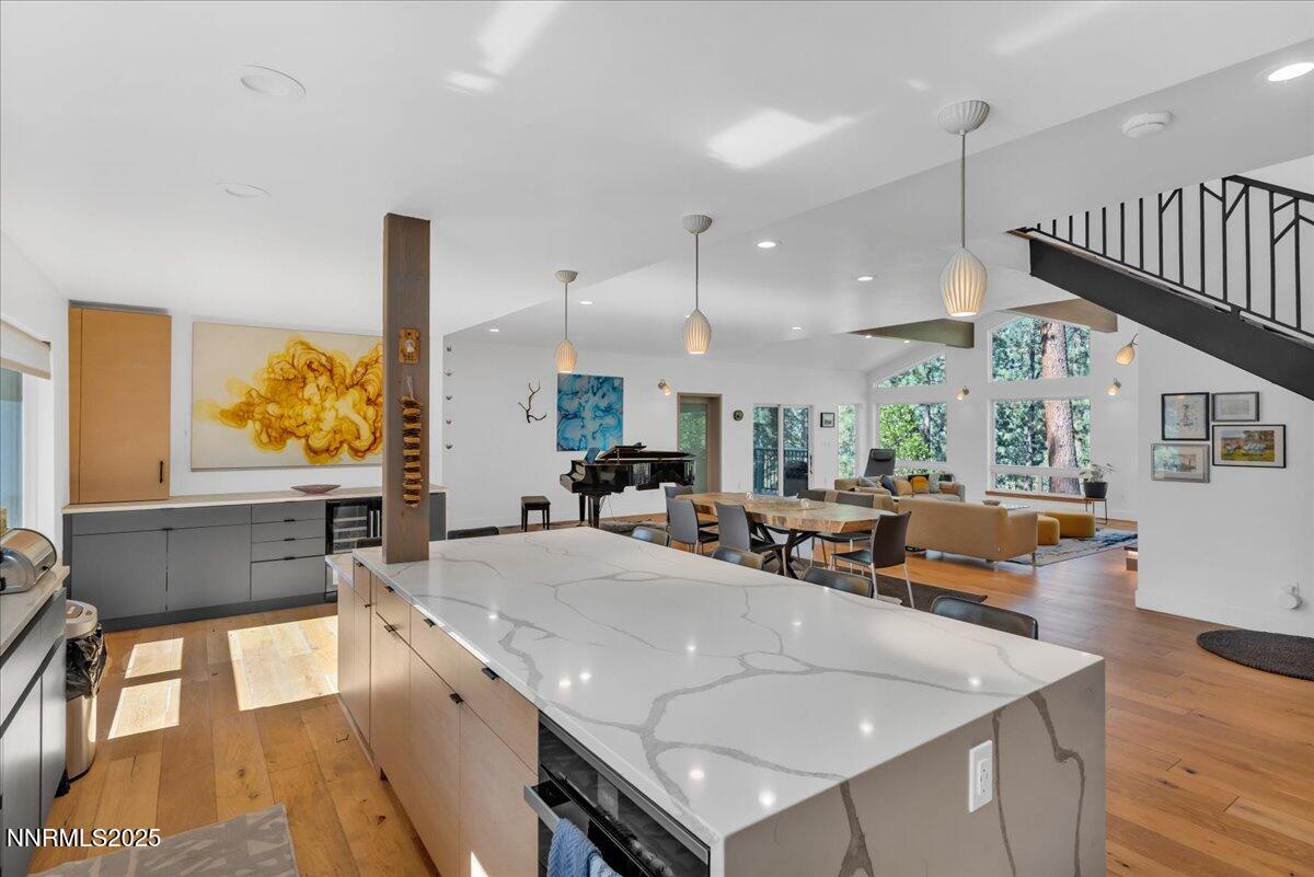 1262 Hidden Woods Drive Zephyr Cove, NV 89448 - Photo 17 of 81 a kitchen with stainless steel appliances granite countertop a sink a stove and a wooden floors