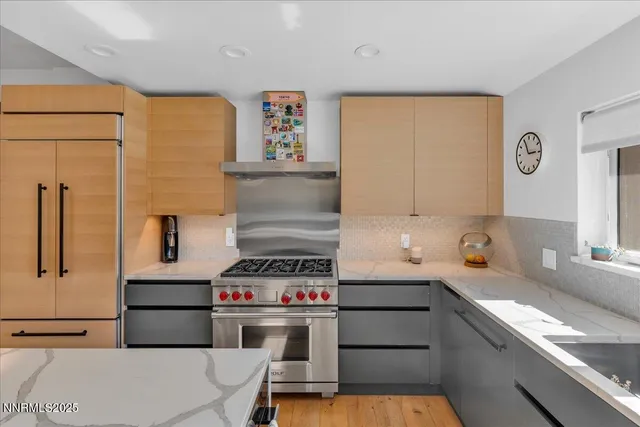 a bedroom with furniture and a large window