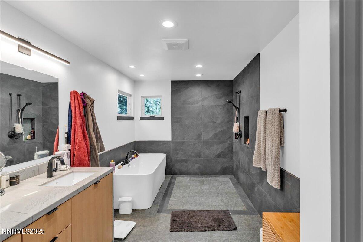 1262 Hidden Woods Drive Zephyr Cove, NV 89448 - Photo 28 of 81 a bathroom with a sink and a tub
