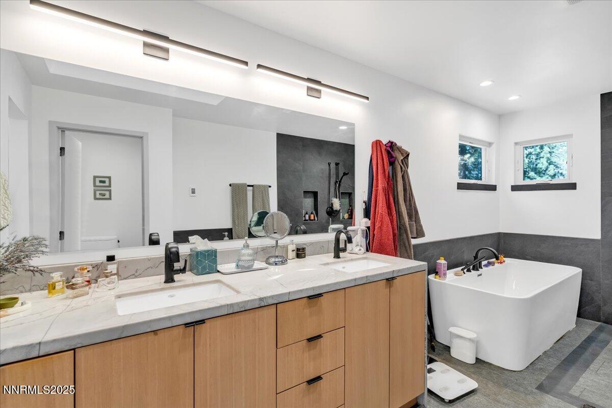 1262 Hidden Woods Drive Zephyr Cove, NV 89448 - Photo 32 of 81 a bathroom with a double vanity sink and a mirror
