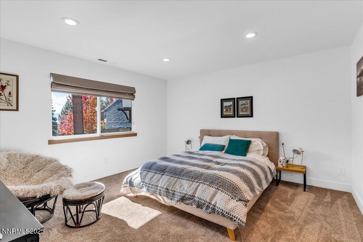 1262 Hidden Woods Drive Zephyr Cove, NV 89448 - Photo 33 of 81 a bedroom with a bed and chair