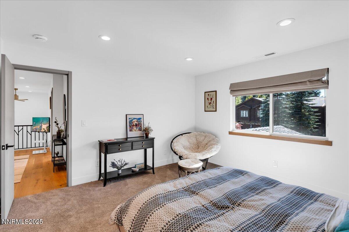 1262 Hidden Woods Drive Zephyr Cove, NV 89448 - Photo 35 of 81 a bedroom with a bed and wooden floor