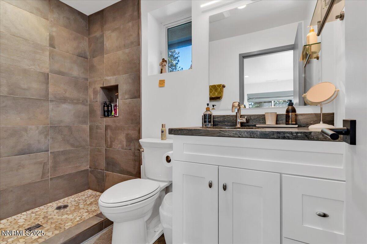 1262 Hidden Woods Drive Zephyr Cove, NV 89448 - Photo 36 of 81 a bathroom with a toilet sink and shower