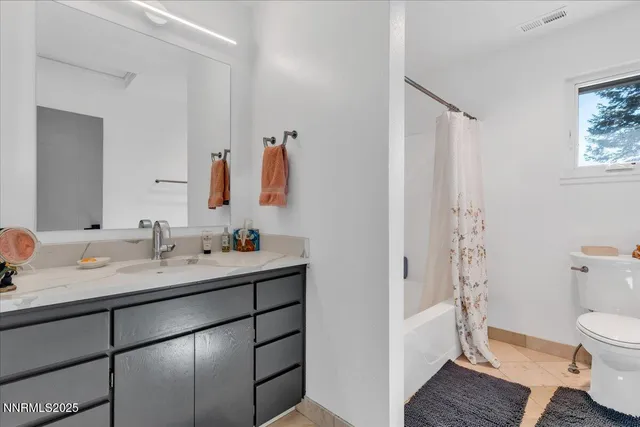 a view of a chairs and table in the patio