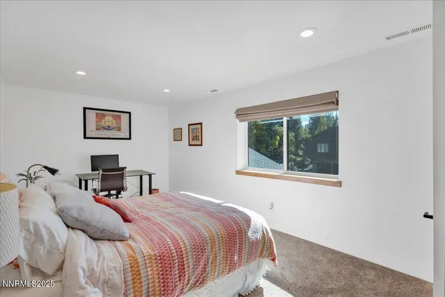 a view of a patio with chair and tables back yard of the house
