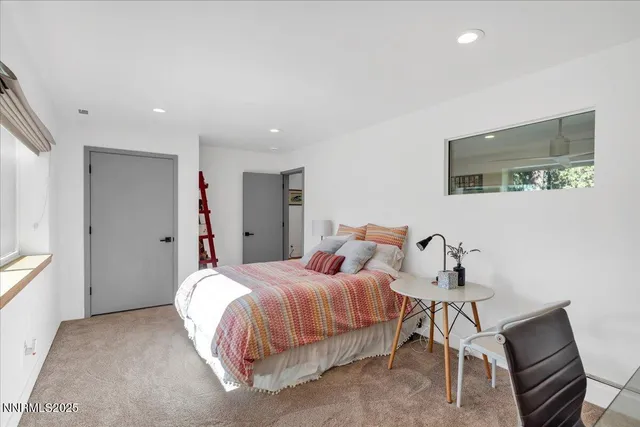 a view of a deck with table and chairs with wooden floor and fence