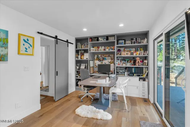 a view of balcony with furniture and wooden fence
