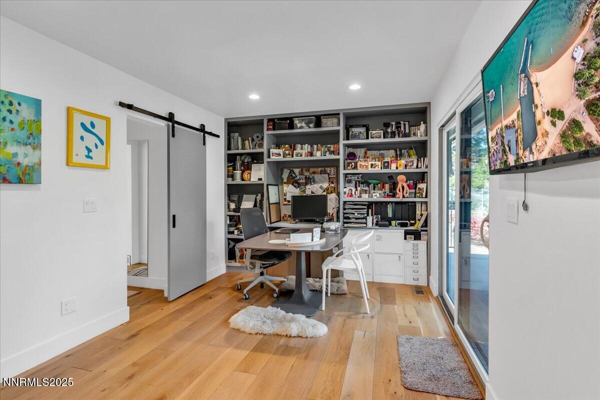 1262 Hidden Woods Drive Zephyr Cove, NV 89448 - Photo 45 of 81 a room with a book shelf and a view of living room