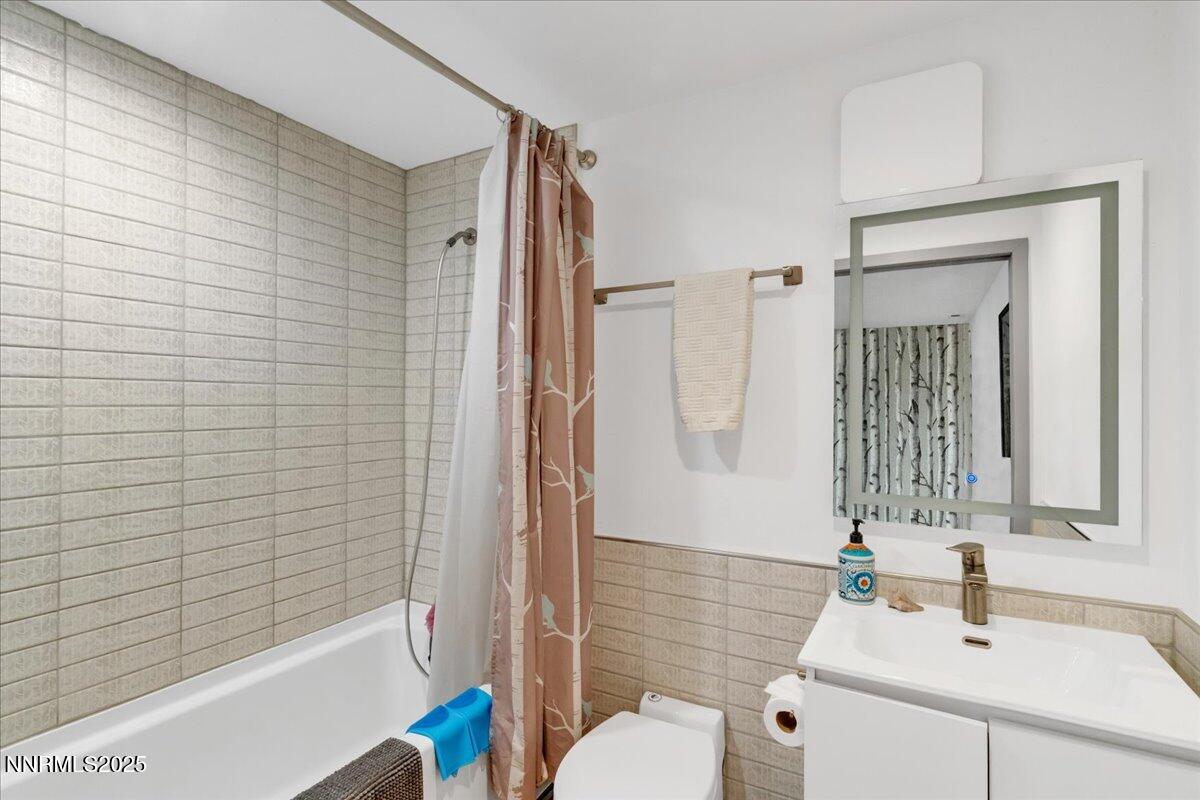 1262 Hidden Woods Drive Zephyr Cove, NV 89448 - Photo 48 of 81 a bathroom with a sink toilet and shower