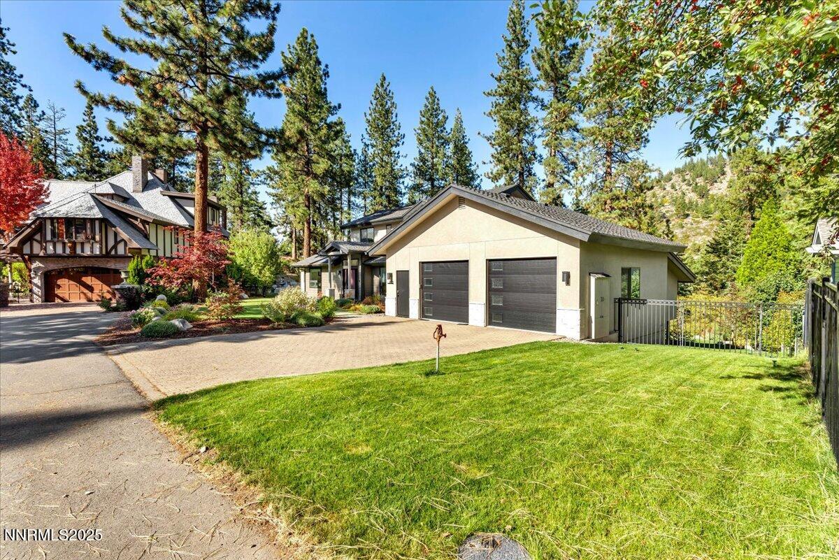 1262 Hidden Woods Drive Zephyr Cove, NV 89448 - Photo 70 of 81 a front view of a house with a yard and trees