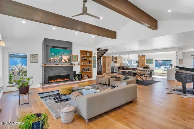 a living room with furniture and a book shelf