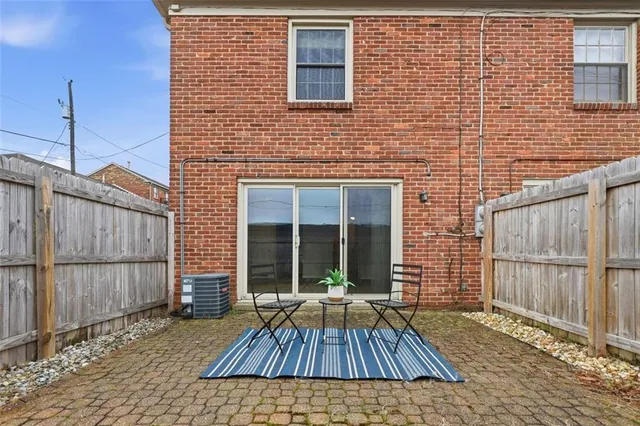 a view of wooden house with a large window
