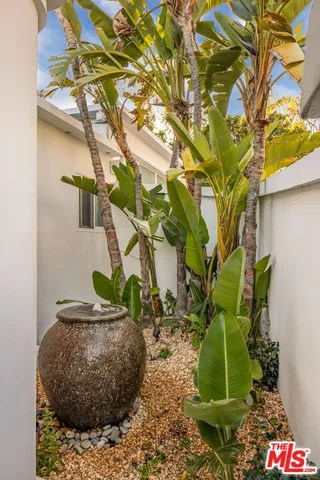 an aerial view of a house with a garden