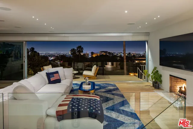 a outdoor living space with furniture and city view